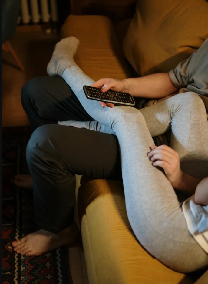 A couple relaxing on a sofa Source Pexels